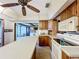 The kitchen includes wood cabinets, a center island, a range, and a microwave at 4709 Mineola St, Bradenton, FL 34207