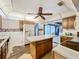 Spacious kitchen featuring an island, vintage wood cabinets, and ample counter space, ready for customization at 4709 Mineola St, Bradenton, FL 34207