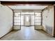 Living room with an entryway and clear sightline to the front door, featuring built-in shelving units at 4709 Mineola St, Bradenton, FL 34207