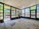 Enclosed glass patio filled with light, offering views of the surrounding landscape at 4709 Mineola St, Bradenton, FL 34207