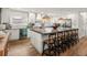 Bright kitchen featuring stainless steel appliances, a large island, and modern lighting at 4710 W Tambay Ave, Tampa, FL 33611