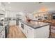 Modern kitchen with a large island, stainless steel appliances, and open concept design at 4710 W Tambay Ave, Tampa, FL 33611
