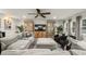 Cozy living room featuring a comfortable sectional, built-in cabinets, and plenty of natural light at 4710 W Tambay Ave, Tampa, FL 33611