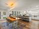 Open-concept living space combining kitchen, dining area, and ample natural light at 4710 W Tambay Ave, Tampa, FL 33611