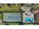 Aerial view featuring a tennis court and community pool at 501 E Bay Dr # 102, Largo, FL 33770
