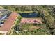 Aerial view featuring a pond with a fountain and a shuffleboard court at 501 E Bay Dr # 102, Largo, FL 33770