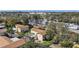 Aerial view of condos with palm trees, parking, and surrounding neighborhood at 501 E Bay Dr # 102, Largo, FL 33770