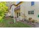 Exterior view of home, showing small backyard with plants at 501 E Bay Dr # 102, Largo, FL 33770