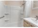 Clean bathroom featuring a shower, and a modern sink with cabinet, and essential fixtures at 501 E Bay Dr # 102, Largo, FL 33770