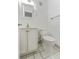 Clean bathroom features a white vanity, toilet, and tiled floors at 501 E Bay Dr # 102, Largo, FL 33770