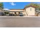 Exterior view showing stairs to the units and covered parking spaces, adding convenience for residents at 501 E Bay Dr # 102, Largo, FL 33770