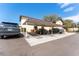 Exterior view featuring parking and stairs leading to the units, with covered parking spots at 501 E Bay Dr # 102, Largo, FL 33770
