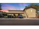 Exterior view of the building with covered parking spaces available, and stairs to the units at 501 E Bay Dr # 102, Largo, FL 33770