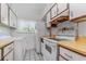 Functional kitchen with updated appliances, cabinets, and a window for natural light at 501 E Bay Dr # 102, Largo, FL 33770