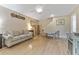 Inviting living room with hardwood floors, a plush sofa, and stylish decor at 501 E Bay Dr # 102, Largo, FL 33770