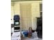Exterior back entrance with a combination of functional items stored on the porch at 5279 Eureka Springs Rd, Tampa, FL 33610