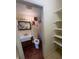 Bathroom features a new vanity with sink, toilet, and a well lit mirror at 5279 Eureka Springs Rd, Tampa, FL 33610