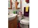 Cozy bathroom featuring a single sink vanity and coordinating fixtures at 5279 Eureka Springs Rd, Tampa, FL 33610
