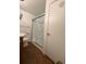 Modest bathroom featuring a glass-enclosed shower at 5279 Eureka Springs Rd, Tampa, FL 33610
