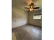 Bedroom featuring a ceiling fan, window providing natural light, and neutral walls at 5279 Eureka Springs Rd, Tampa, FL 33610