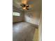 Modest bedroom with ceiling fan and natural light at 5279 Eureka Springs Rd, Tampa, FL 33610