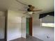 Bedroom features ceiling fan, hardwood floors, and a closet at 5279 Eureka Springs Rd, Tampa, FL 33610