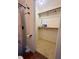 Bright closet features shelving, hanger bar, and easy access from the bathroom area at 5279 Eureka Springs Rd, Tampa, FL 33610