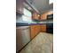 Bright kitchen features stainless steel appliances, granite counters, and ample cabinet space at 5279 Eureka Springs Rd, Tampa, FL 33610