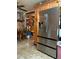 Kitchen featuring stainless steel refrigerator and wood cabinets at 5279 Eureka Springs Rd, Tampa, FL 33610