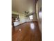 Open living room with hardwood floors and plenty of natural light at 5279 Eureka Springs Rd, Tampa, FL 33610
