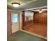 View of the living room featuring wood-look floors, ceiling fan, and natural light at 5279 Eureka Springs Rd, Tampa, FL 33610
