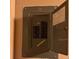 Electrical panel with a hinged metal door at 5279 Eureka Springs Rd, Tampa, FL 33610