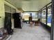 Enclosed back patio with furniture and storage at 5279 Eureka Springs Rd, Tampa, FL 33610