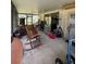 Covered patio with furniture; great potential for outdoor dining and relaxation at 5279 Eureka Springs Rd, Tampa, FL 33610