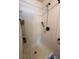 Clean shower showcasing modern fixtures and a functional design for a refreshing experience at 5279 Eureka Springs Rd, Tampa, FL 33610