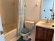Bathroom with tile shower, tub, toilet and vanity with wood cabinet at 5804 Red Cedar Ln # 5804, Tampa, FL 33625