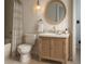 Modern bathroom features stylish vanity, round mirror, bathtub and walk in shower at 5804 Red Cedar Ln # 5804, Tampa, FL 33625