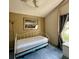 Vaulted bedroom with daybed, pullout trundle, and natural light from side window at 5804 Red Cedar Ln # 5804, Tampa, FL 33625