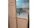 Laundry closet features a washer and dryer with shelving for organizing at 5804 Red Cedar Ln # 5804, Tampa, FL 33625
