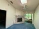 Cozy living room with a white tile fireplace, skylight, and a ceiling fan for added comfort at 5804 Red Cedar Ln # 5804, Tampa, FL 33625