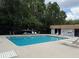 Large community pool surrounded by chairs with a fenced-in area at 5804 Red Cedar Ln # 5804, Tampa, FL 33625