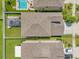 Aerial view of roof showing backyard with pool and patio at 7211 Ronnie Gardens Ct, Tampa, FL 33619