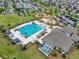 Aerial view of the community pool and recreation area, featuring a playground and clubhouse at 7211 Ronnie Gardens Ct, Tampa, FL 33619