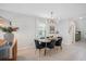 Cozy dining area featuring stylish lighting, a round table, and seating for four at 7211 Ronnie Gardens Ct, Tampa, FL 33619