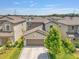 Beautiful single-Gathering home with a large garage, well-maintained landscaping, and neutral color palette at 7211 Ronnie Gardens Ct, Tampa, FL 33619