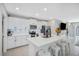 Modern kitchen with white cabinetry, stainless steel appliances, and a spacious center island at 7211 Ronnie Gardens Ct, Tampa, FL 33619