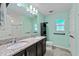Spacious bathroom with double sink vanity and cabinet at 7302 Sunshine Bridge Ave, Gibsonton, FL 33534