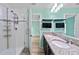 Nicely appointed bathroom with shower and granite countertop at 7302 Sunshine Bridge Ave, Gibsonton, FL 33534