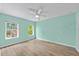 Bright bedroom features two windows and a ceiling fan at 7302 Sunshine Bridge Ave, Gibsonton, FL 33534
