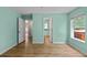Bedroom with vinyl floors, walk through, and natural light at 7302 Sunshine Bridge Ave, Gibsonton, FL 33534